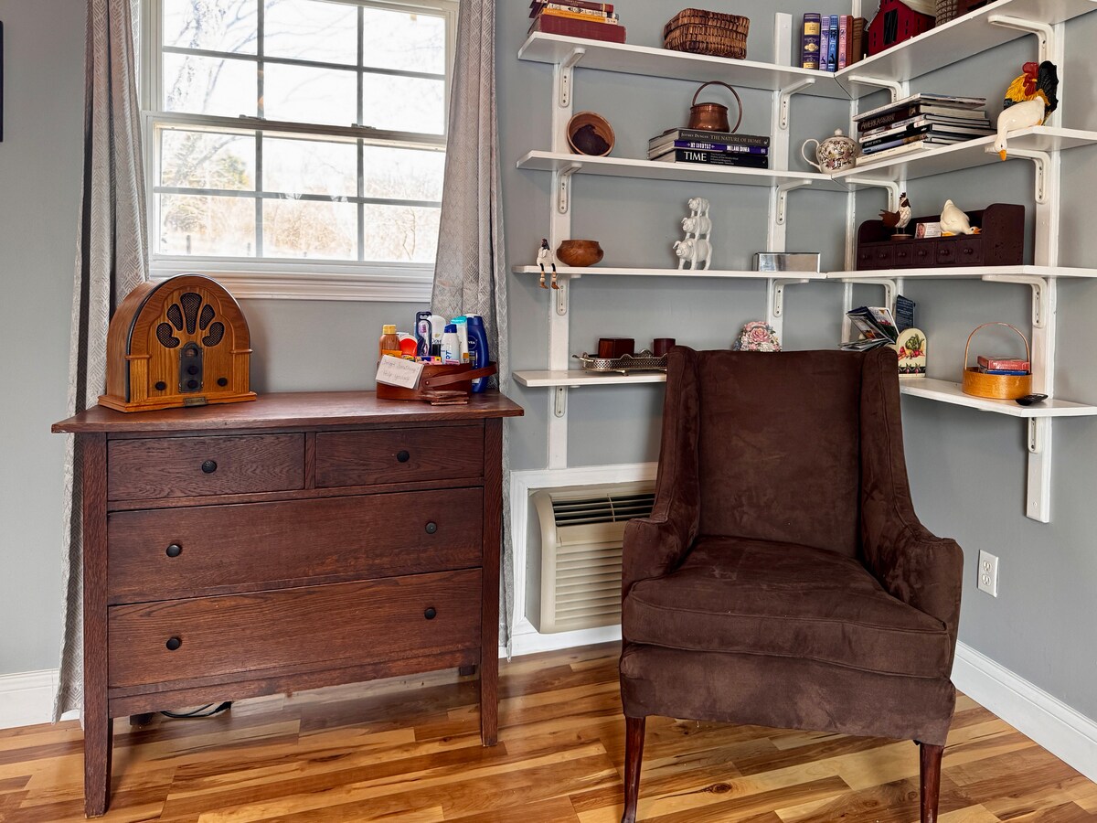 Cozy bedroom corner with dresser and reading chair