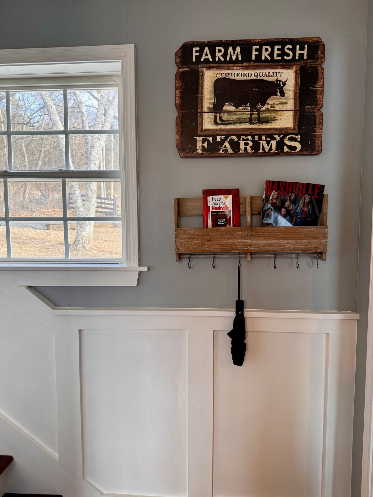 Farm Fresh Family Farms sign by a window over the pasture